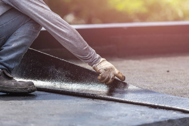 Professional Basement Waterproofing technician working in Norman, IN